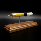 Side view of a Remington AccuTip 20 gauge slug display featuring separated shotshell components on walnut base