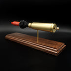 Handcrafted 20mm Vulcan MK244 APDS cartridge display with separated projectile, powder, and primer assembly on walnut base