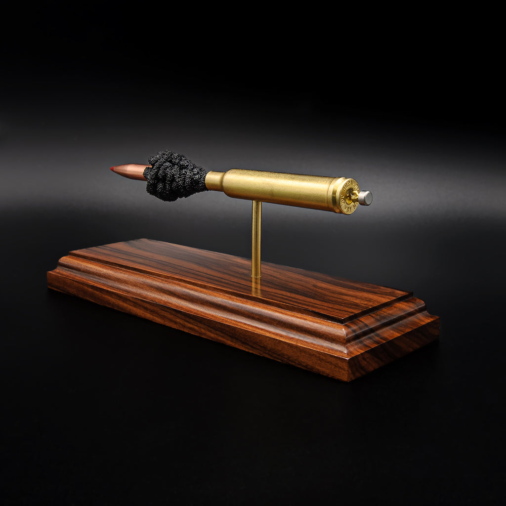 Angled rear view of a .300 Weatherby Magnum Hornady Precision Hunter 200gr ELD-X cartridge anatomy display featuring the primer cup, anvil, cartridge case, simulated powder, and projectile on a Bolivian rosewood base.
