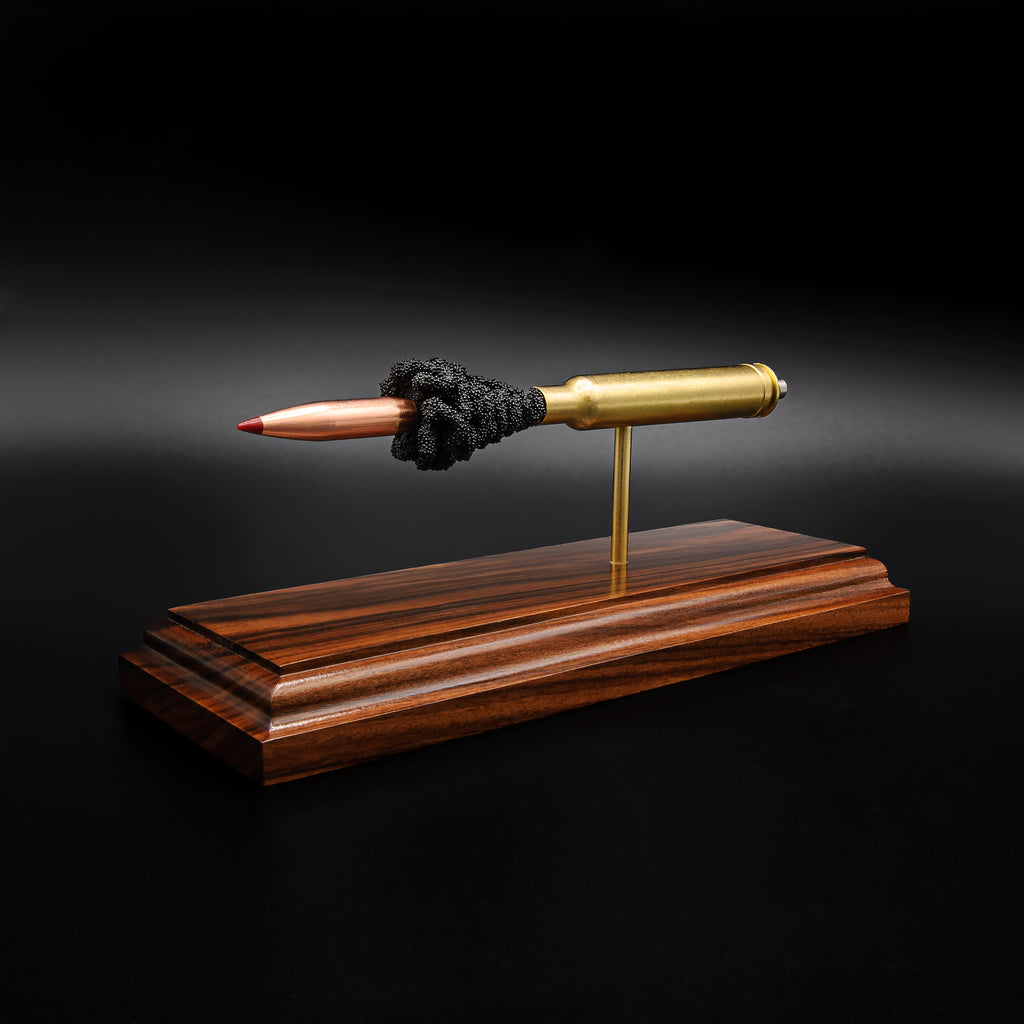 Opposite side view of a .300 Weatherby Magnum Hornady Precision Hunter 200gr ELD-X cartridge anatomy display showing the primer cup, anvil, cartridge case, simulated powder, and projectile on a Bolivian rosewood base.