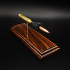 Front angled view of a .300 Weatherby Magnum Hornady Precision Hunter 200gr ELD-X cartridge anatomy display with the primer cup, anvil, cartridge case, simulated powder, and projectile mounted on a Bolivian rosewood base.