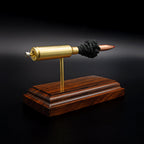 Rear view of a .300 WSM cartridge anatomy display showing the cartridge case head, primer cup, anvil, simulated powder, and projectile on a Bolivian rosewood base.