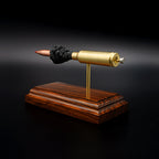 Angled rear view of a .300 WSM cartridge anatomy display featuring the primer cup, anvil, cartridge case, simulated powder, and projectile on a Bolivian rosewood base.