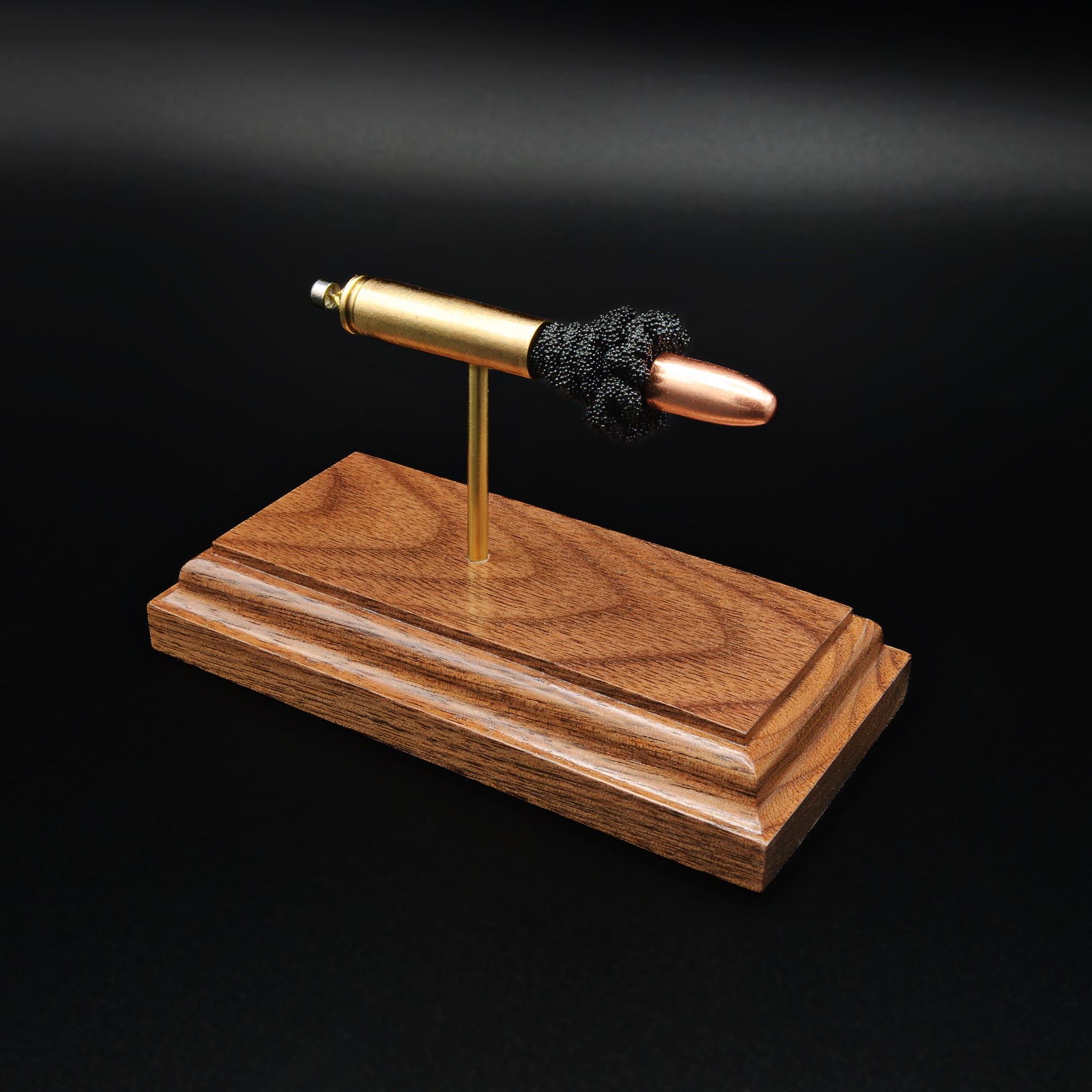 30 Carbine FMJ exploded cartridge anatomy model on walnut base