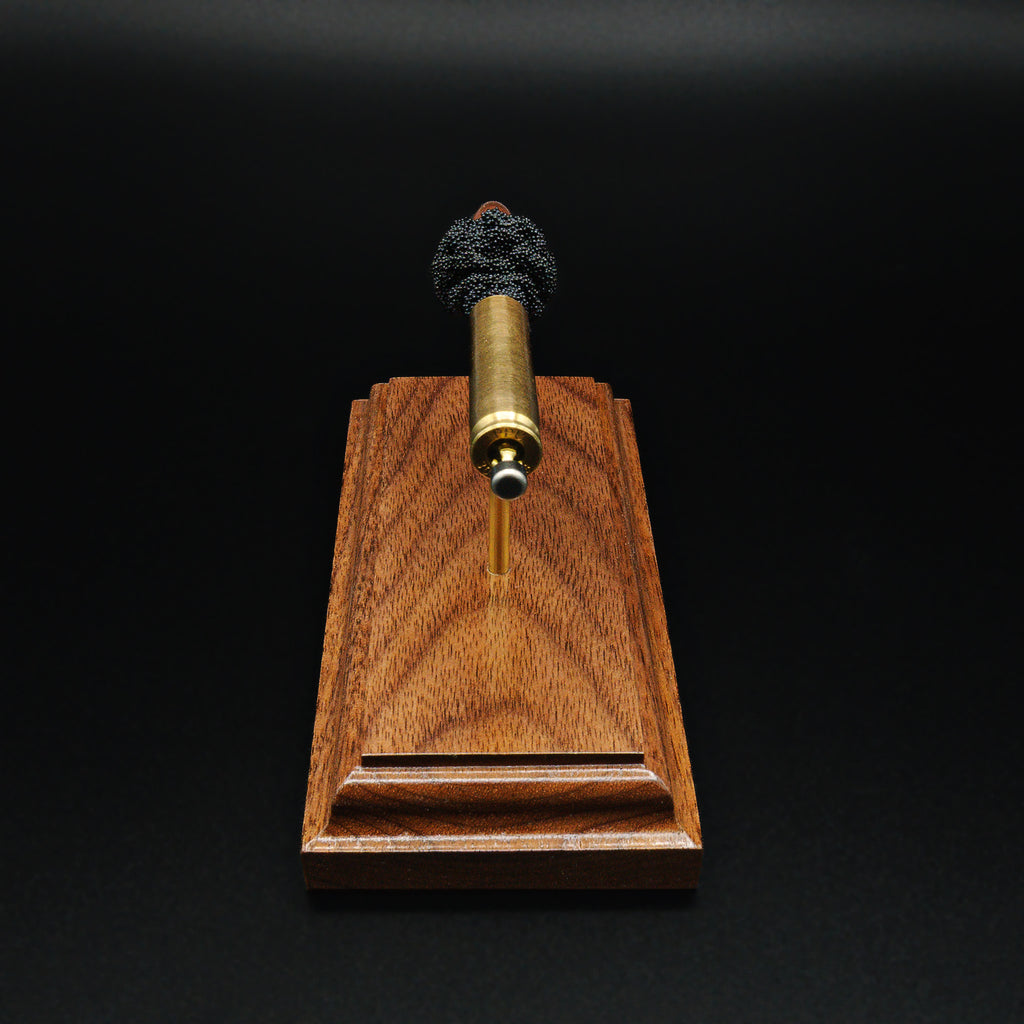 Top-down view of 30 Carbine exploded cartridge showing full component alignment