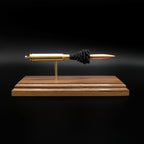 Front profile of a handcrafted .338 Winchester Magnum exploded cartridge display featuring a Sierra MatchKing HPBT 300gr bullet with simulated powder on a walnut wood base.