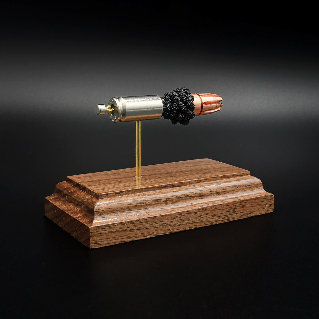 40 S&W G2 Research RIP bullet anatomy model showing case, powder, and projectile on walnut base