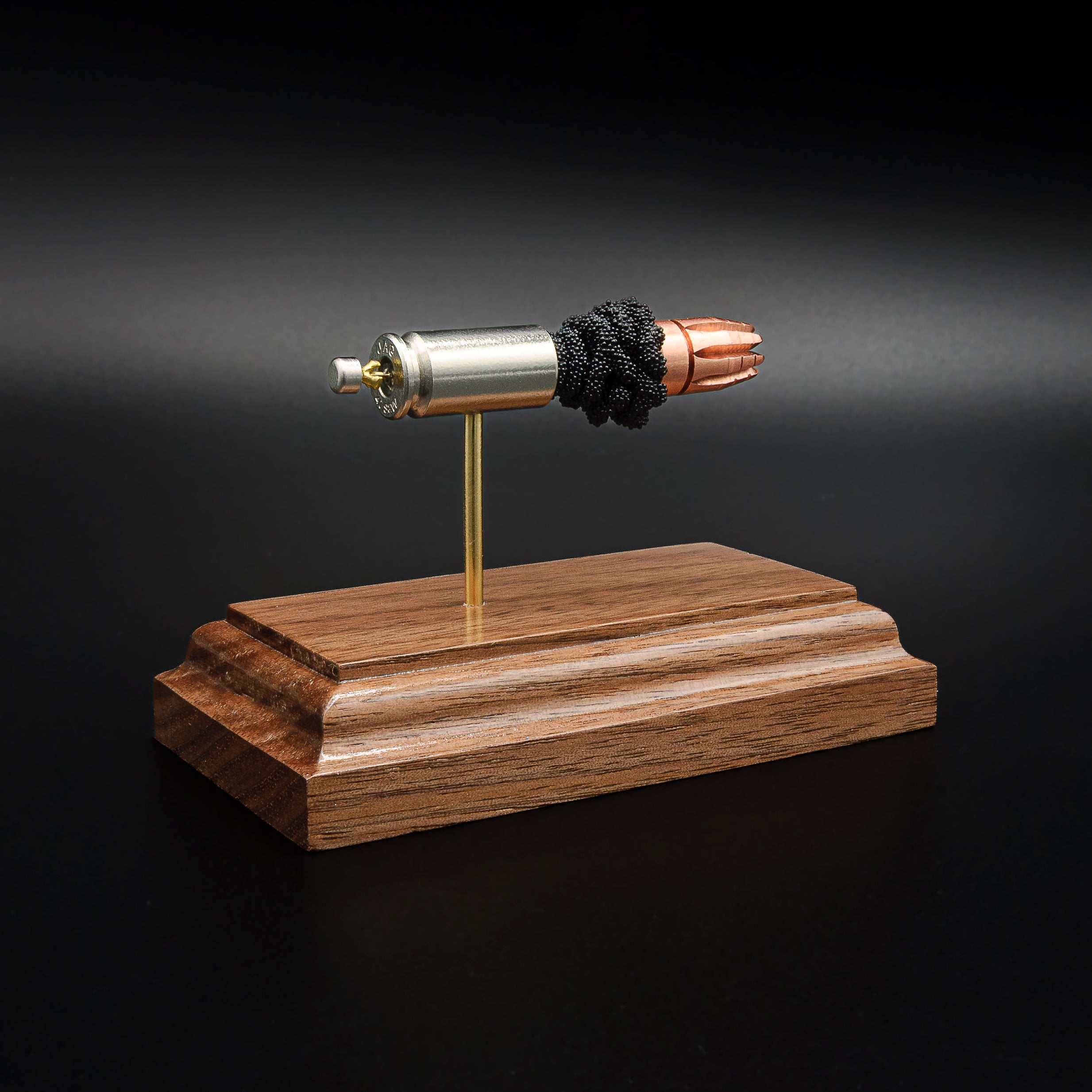 40 S&W G2 Research RIP bullet anatomy model showing case, powder, and projectile on walnut base