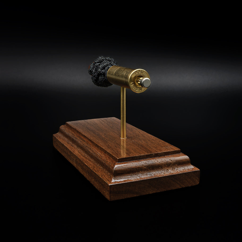 Back angled view of a .44 Magnum cartridge model with separated components, highlighting the brass casing and clustered powder detail