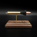 Front profile of a handcrafted .45-70 Government exploded cartridge display featuring a 300gr Hornady InterLock HP bullet with simulated powder on a walnut wood base.