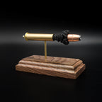 Front three-quarter view of a .45-70 Government anatomy cartridge display highlighting the Hornady 300gr InterLock hollow point bullet and walnut display base.