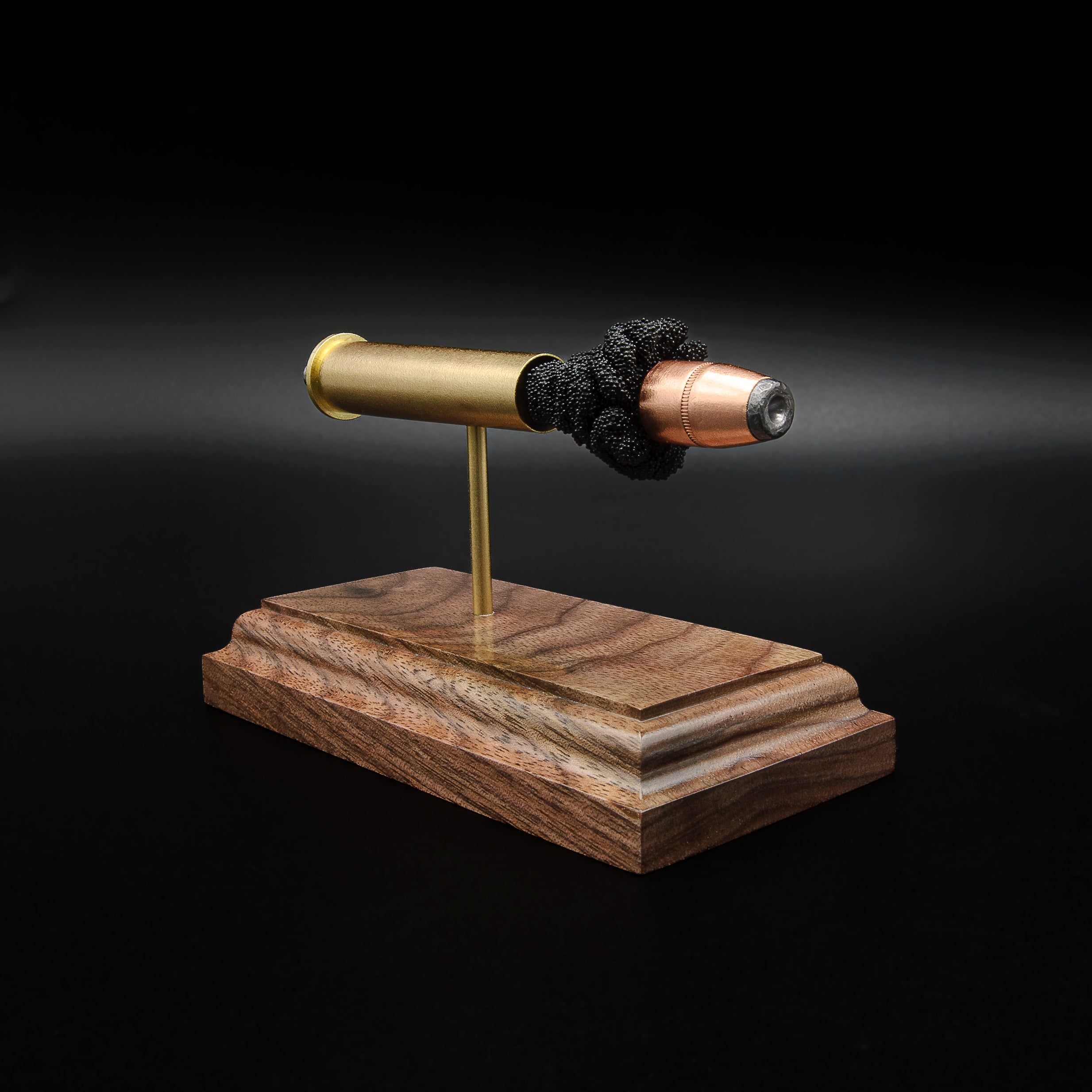 Right-front angle of an inert .45-70 Government exploded ammunition display showing the Hornady 300gr InterLock HP projectile and exposed simulated powder.