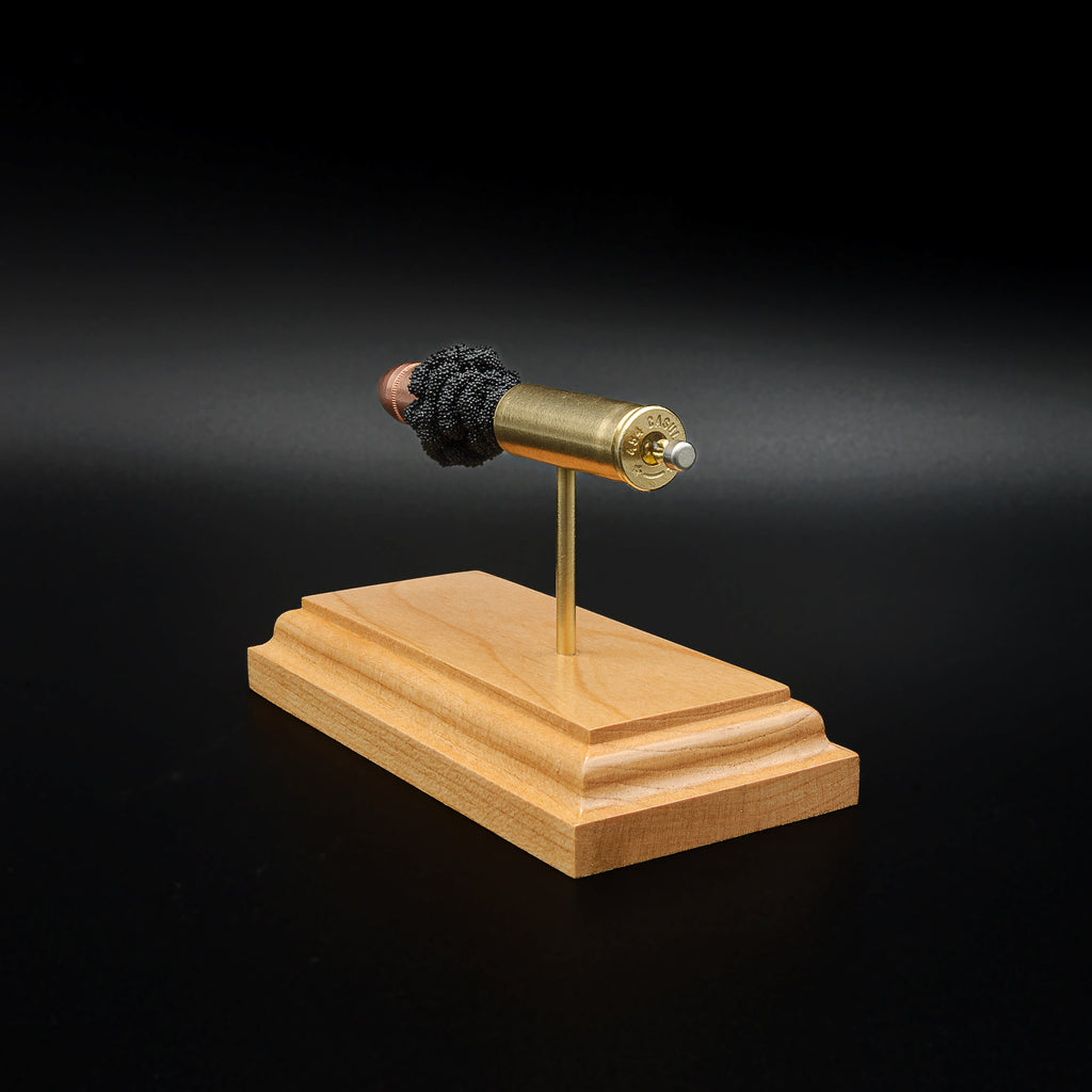 Rear three-quarter perspective of a handcrafted .454 Casull cartridge display highlighting the case head, primer assembly, brass case, Hornady XTP JHP 300gr bullet, and cherry display base.