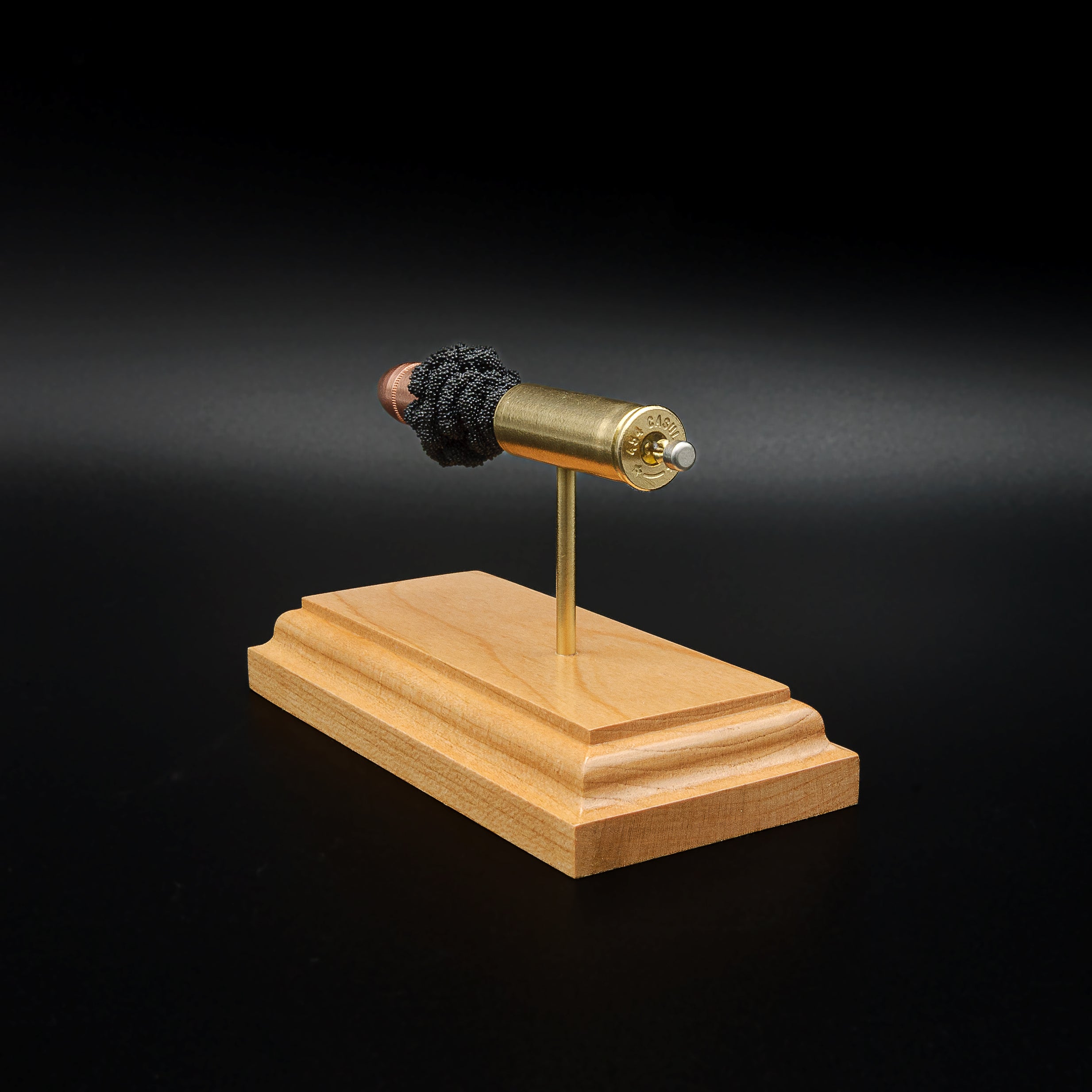 Rear three-quarter perspective of a handcrafted .454 Casull cartridge display highlighting the case head, primer assembly, brass case, Hornady XTP JHP 300gr bullet, and cherry display base.