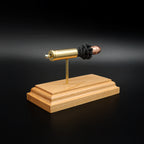 Opposite rear angle of an inert .454 Casull exploded cartridge display featuring a Hornady XTP JHP 300gr hollow point bullet, simulated powder, brass case, and handcrafted cherry wood base.