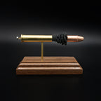 Front view of a 45-70 Government Hornady Sub-X 410gr cartridge anatomy display showing the primer cup, anvil, brass case, simulated powder, and projectile on a walnut base.