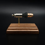 Front view of a .45 Auto Federal 230gr HST JHP cartridge anatomy display showing the primer cup, anvil, cartridge case, simulated powder, and projectile on a walnut wood base.