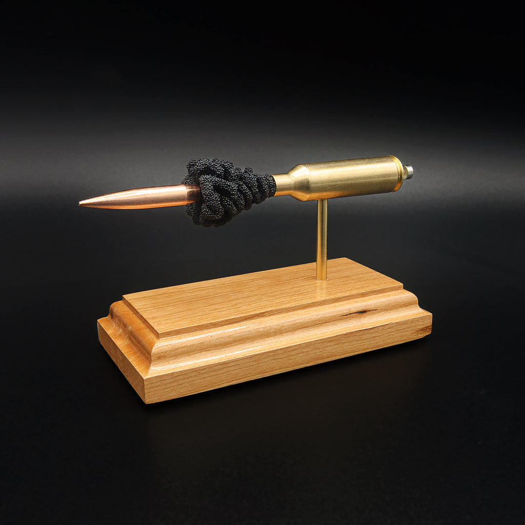 Angled view of a 6.5 PRC Berger 153.5gr LRHT cartridge anatomy display showing the Lapua case head, primer cup, anvil, simulated powder, and projectile.