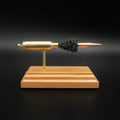 Front view of a 6.5 PRC Berger 153.5gr Long Range Hybrid Target cartridge anatomy display showing the primer cup, anvil, Lapua cartridge case, simulated powder, and projectile on a hardwood base.