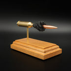 Angled view of a 6.5 PRC Berger 153.5gr LRHT cartridge anatomy display with the primer cup, anvil, Lapua brass cartridge case, simulated powder, and projectile visible.