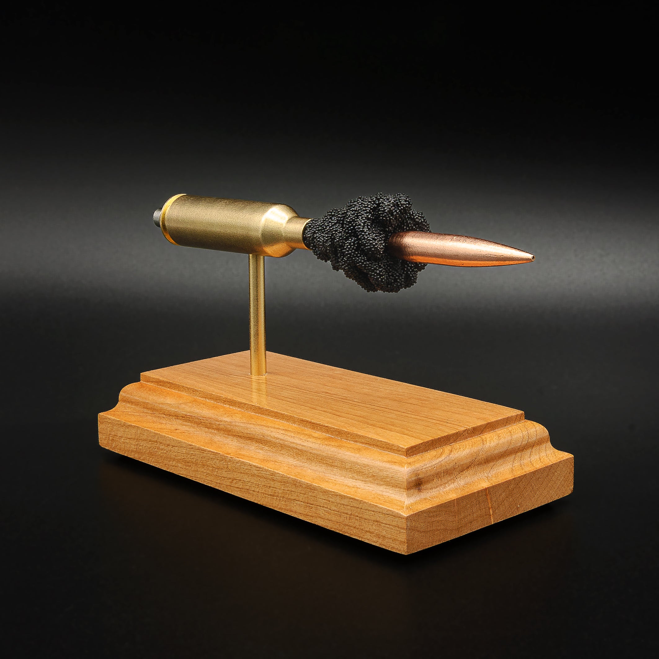 Angled view of a 6.5 PRC Berger 153.5gr LRHT cartridge anatomy display with the primer cup, anvil, Lapua brass cartridge case, simulated powder, and projectile visible.