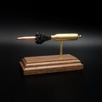 Opposite side profile of an inert 6.5 PRC exploded cartridge display with a Hornady 147gr ELD-M Match bullet, simulated powder, and handcrafted walnut base.