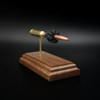 Right-front angle of an inert 6.5 Creedmoor exploded ammunition display showing the Hornady 143gr ELD-X projectile, brass case, and exposed simulated powder.