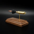 Close rear perspective of a 6.5 Creedmoor anatomy display highlighting the cartridge base, primer details, brass case, and handcrafted walnut base.