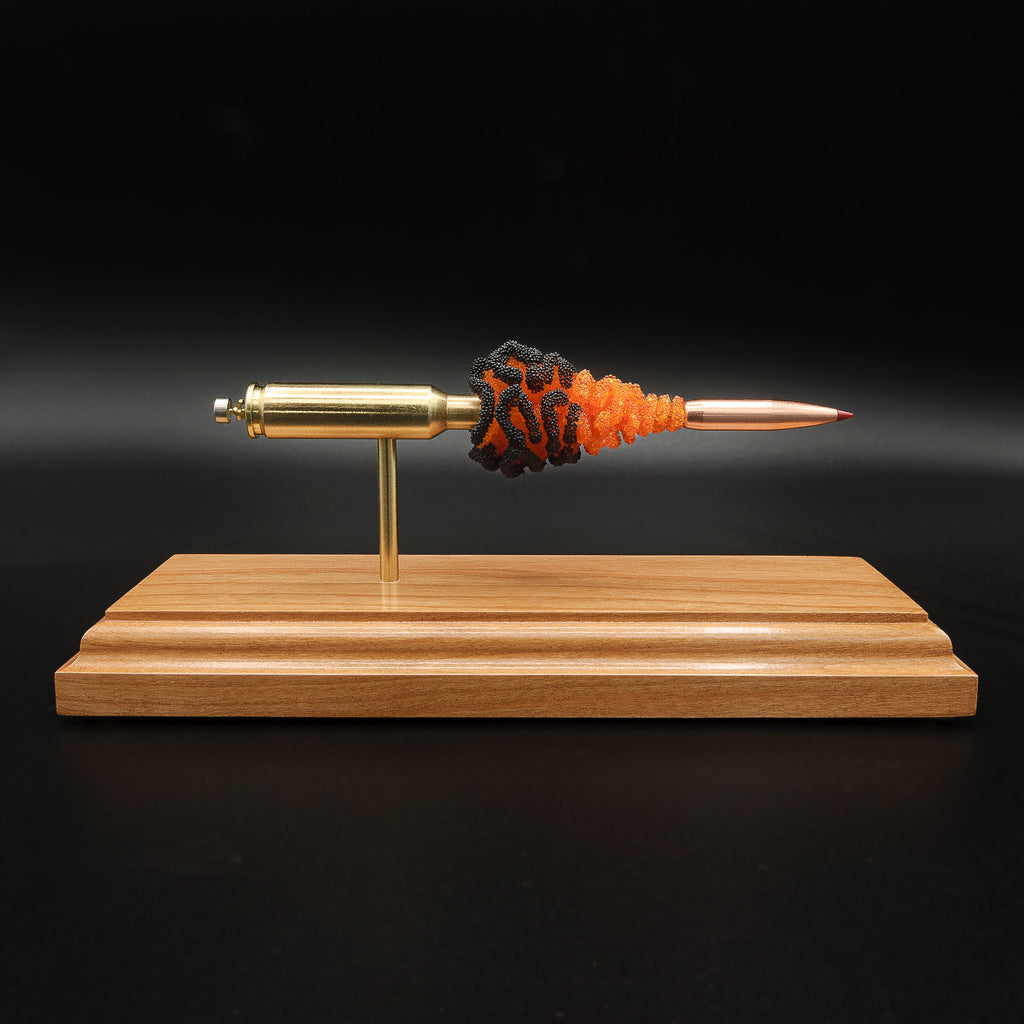6.5 Creedmoor FirePowder cartridge anatomy display with Hornady 143gr ELD-X, Alpha Munitions brass, primer cup, anvil, case, simulated powder, and projectile on cherry.