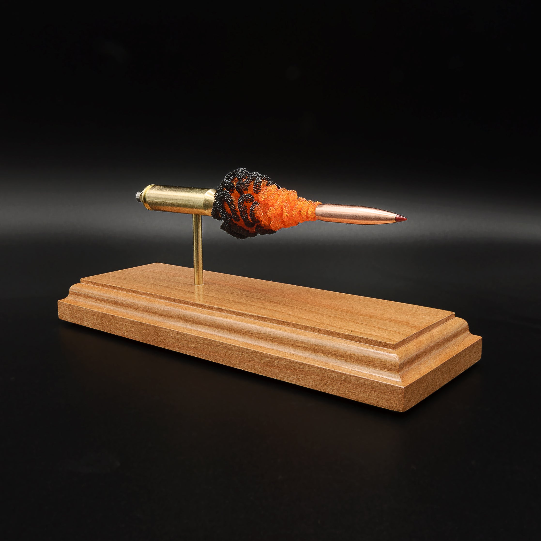 Angled 6.5 Creedmoor FirePowder display showing the Hornady 143gr ELD-X projectile, orange and black simulated powder, Alpha brass case, primer cup, and anvil.