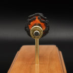 Close rear view of Alpha Munitions 6.5 Creedmoor novelty brass with “6.5 Epstein Didn’t Kill Himself” headstamp on a FirePowder cartridge display.