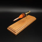 Front angled view of the 6.5 Creedmoor FirePowder display showing the red-tipped Hornady 143gr ELD-X, simulated powder expansion, Alpha brass case, primer cup, and anvil.