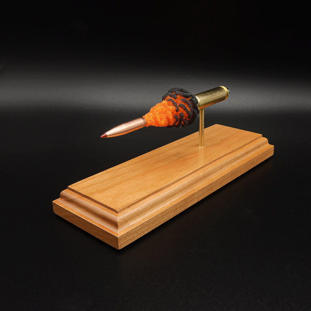 Detailed 6.5 Creedmoor FirePowder cartridge display with Hornady 143gr ELD-X projectile, Alpha Munitions brass, simulated orange and black powder, primer cup, and anvil.