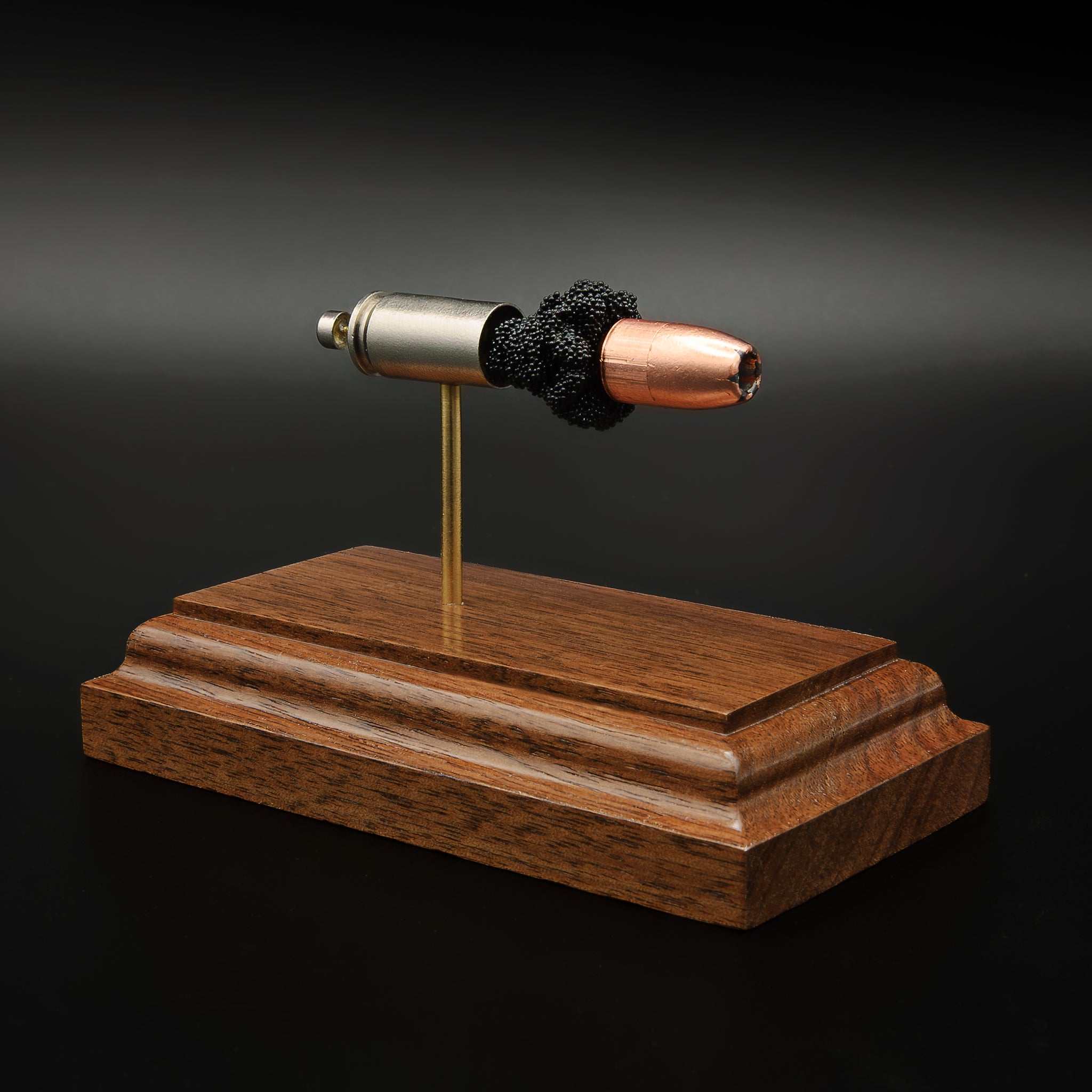 Wide angled view of 9mm Speer Gold Dot exploded cartridge display with separated components