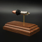Back angled view of 9mm Luger Speer Gold Dot 124gr anatomy model on walnut base