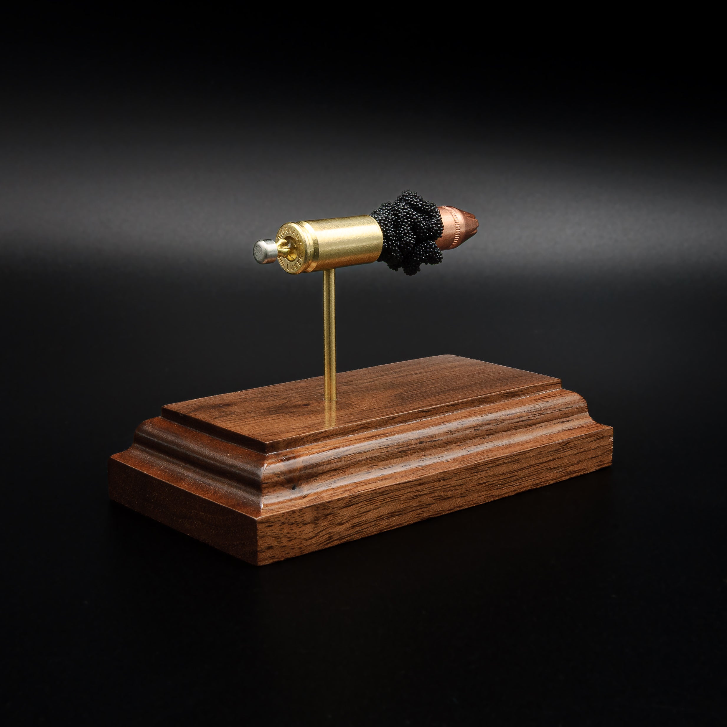 Exploded 9mm Luger Hornady Critical Defense 115gr FTX ammunition display showing internal components