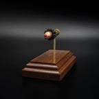 Premium walnut display featuring an exploded 9mm Luger Hornady Critical Defense 115gr FTX cartridge