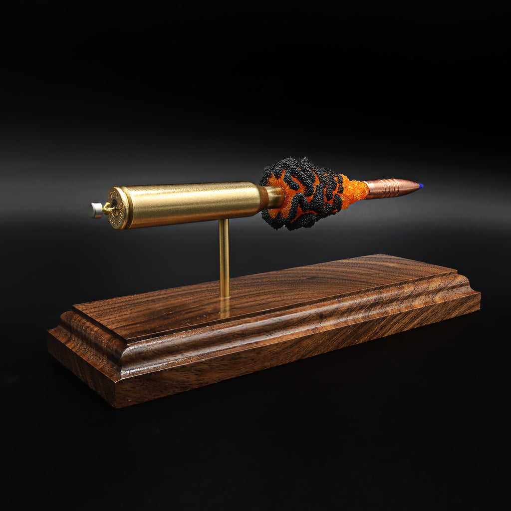 Rear perspective of 338 Lapua cartridge display highlighting primer detail, brass casing, and suspended component layout