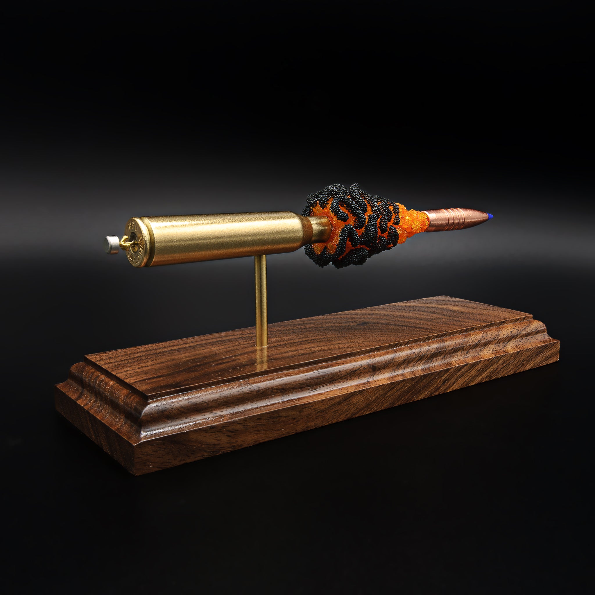 Rear perspective of 338 Lapua cartridge display highlighting primer detail, brass casing, and suspended component layout