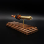 Detailed back angle of exploded rifle cartridge model showing base stamp, primer assembly, and layered powder effect