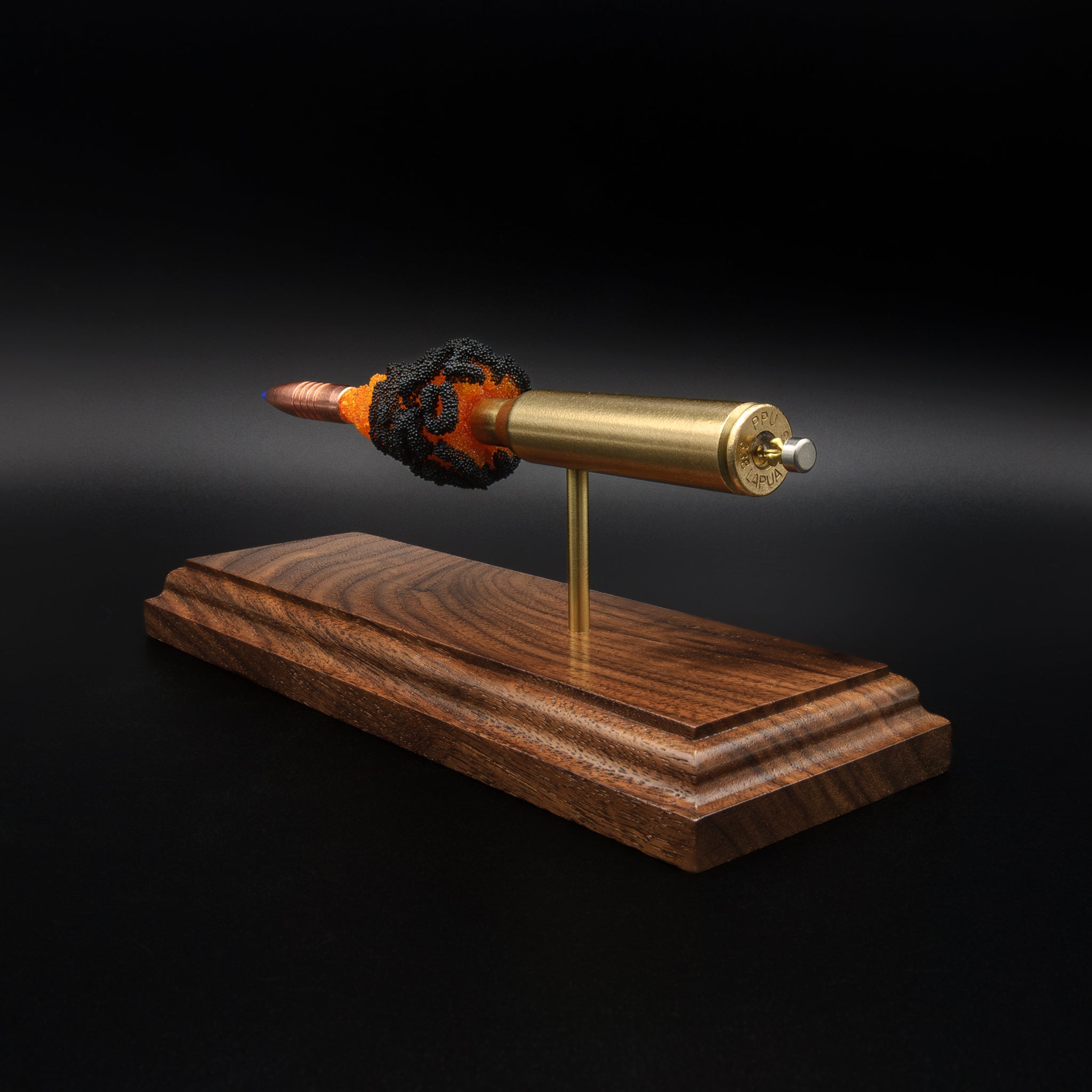 Detailed back angle of exploded rifle cartridge model showing base stamp, primer assembly, and layered powder effect