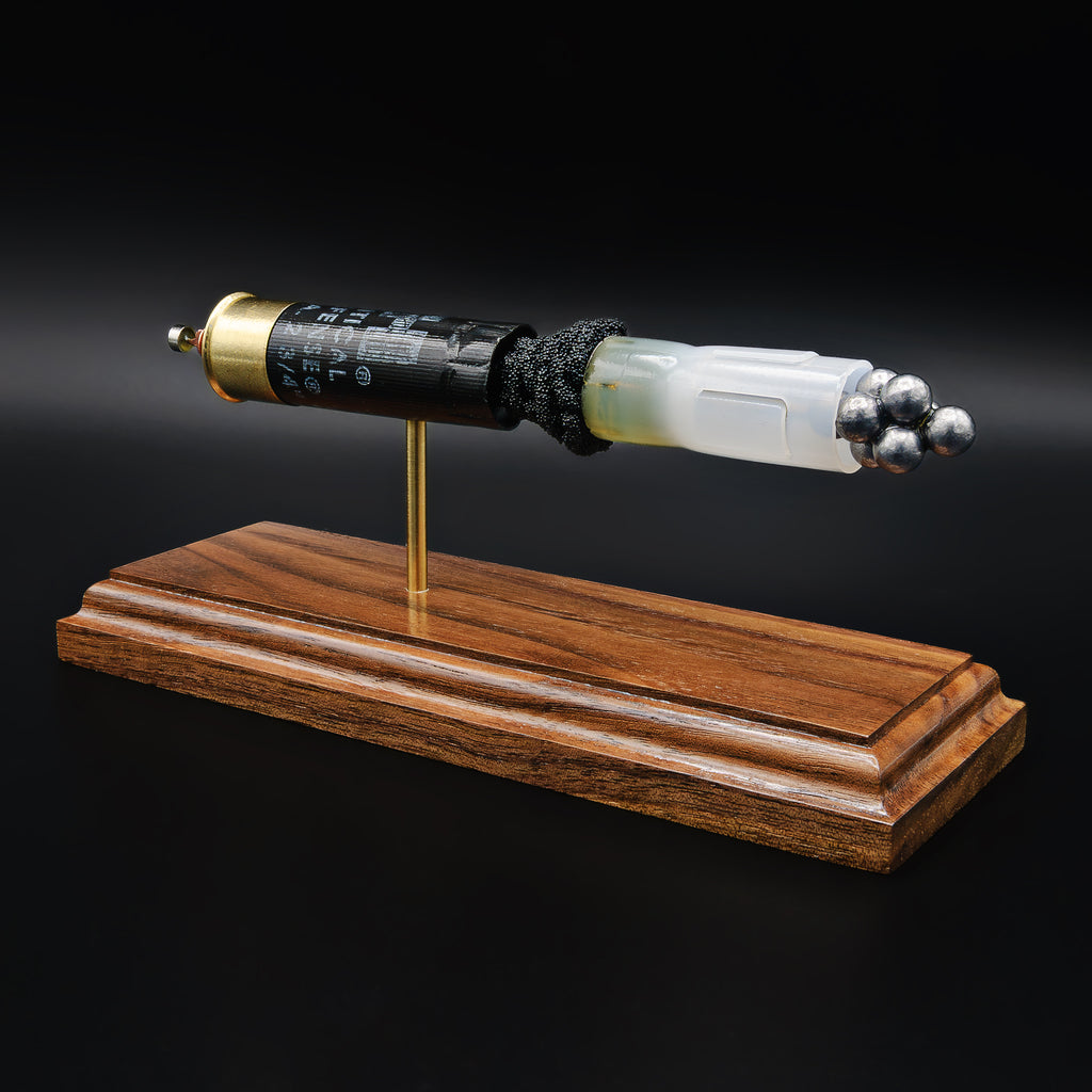 Hornady Critical Defense 12ga buckshot anatomy model with wad, shot pellets, and powder visible