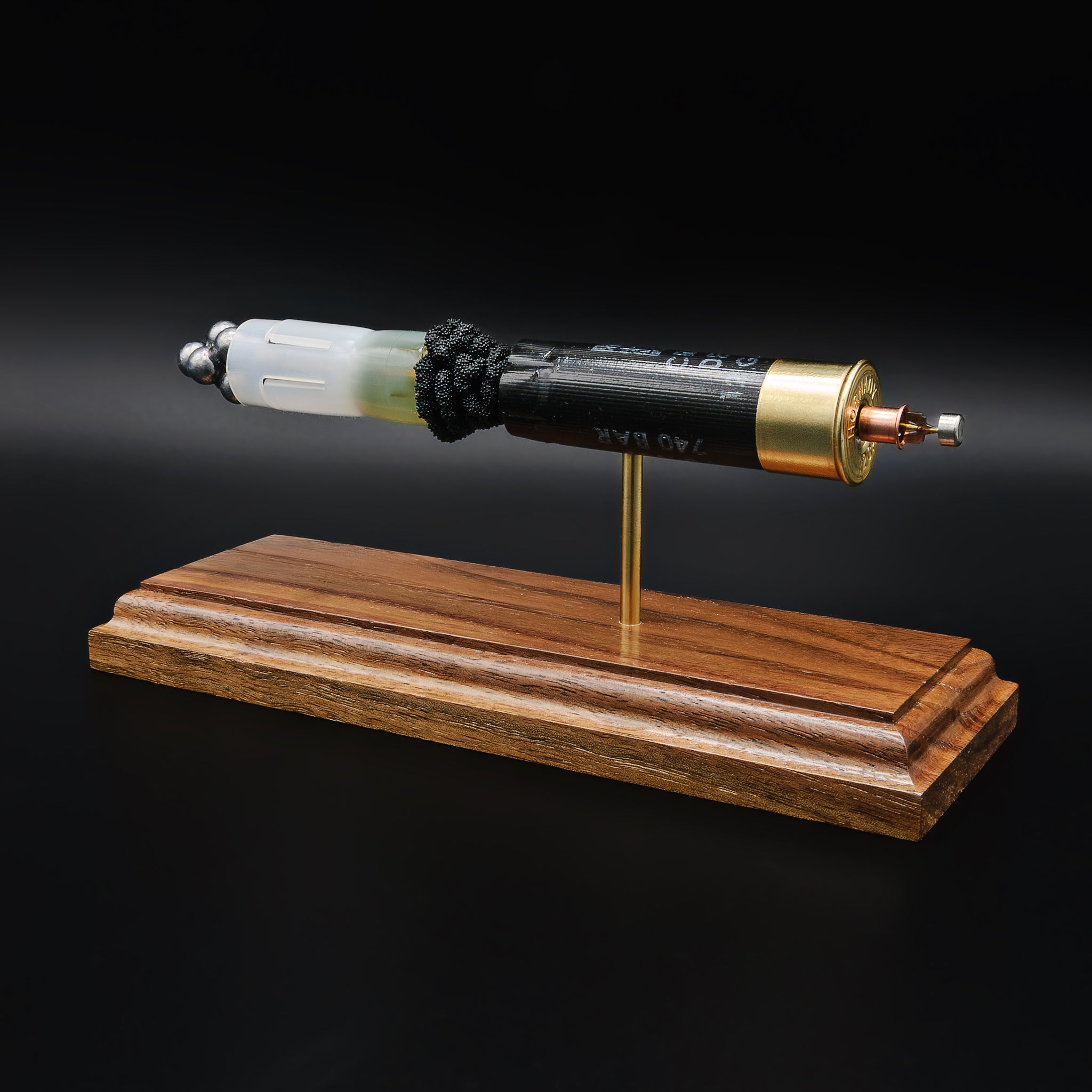 Detailed view of Hornady Critical Defense 12 gauge shotshell with internal components separated