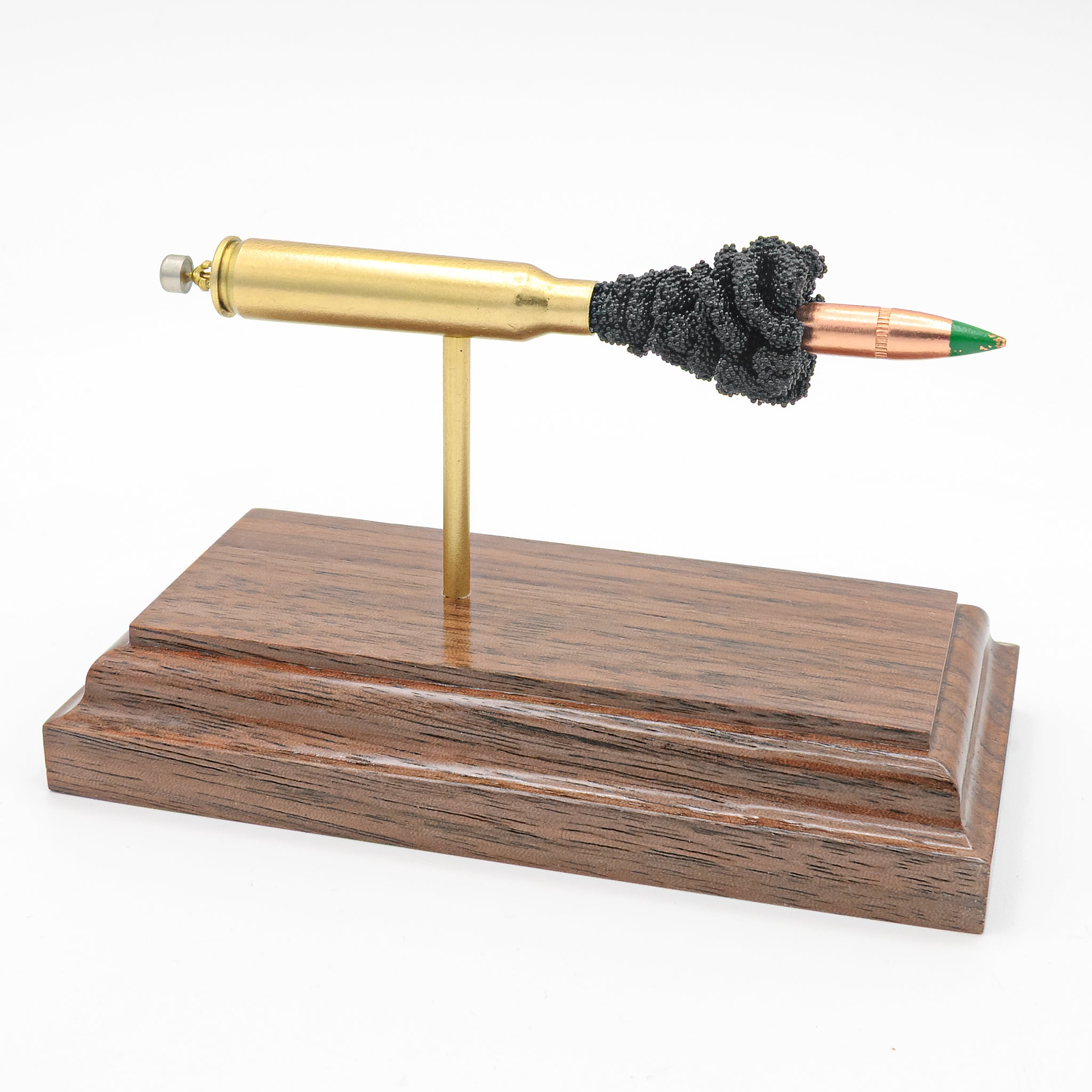 5.56x45mm M855 Green Tip SS109 62gr expanded cartridge display model on walnut base