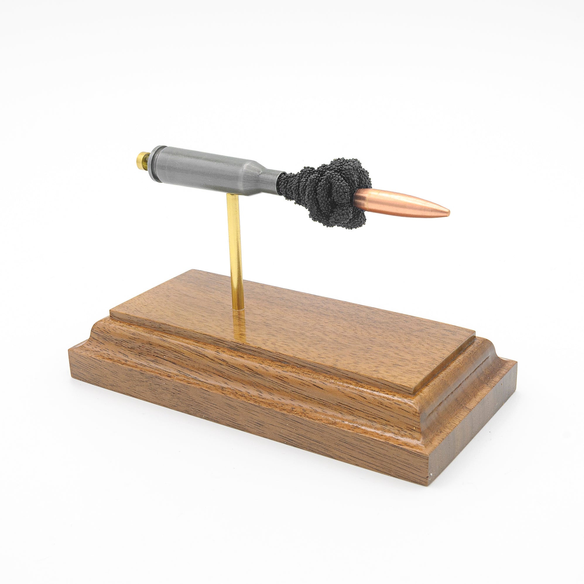 Sectioned 5.45x39mm cartridge showing primer case powder and 60gr FMJ bullet aligned horizontally