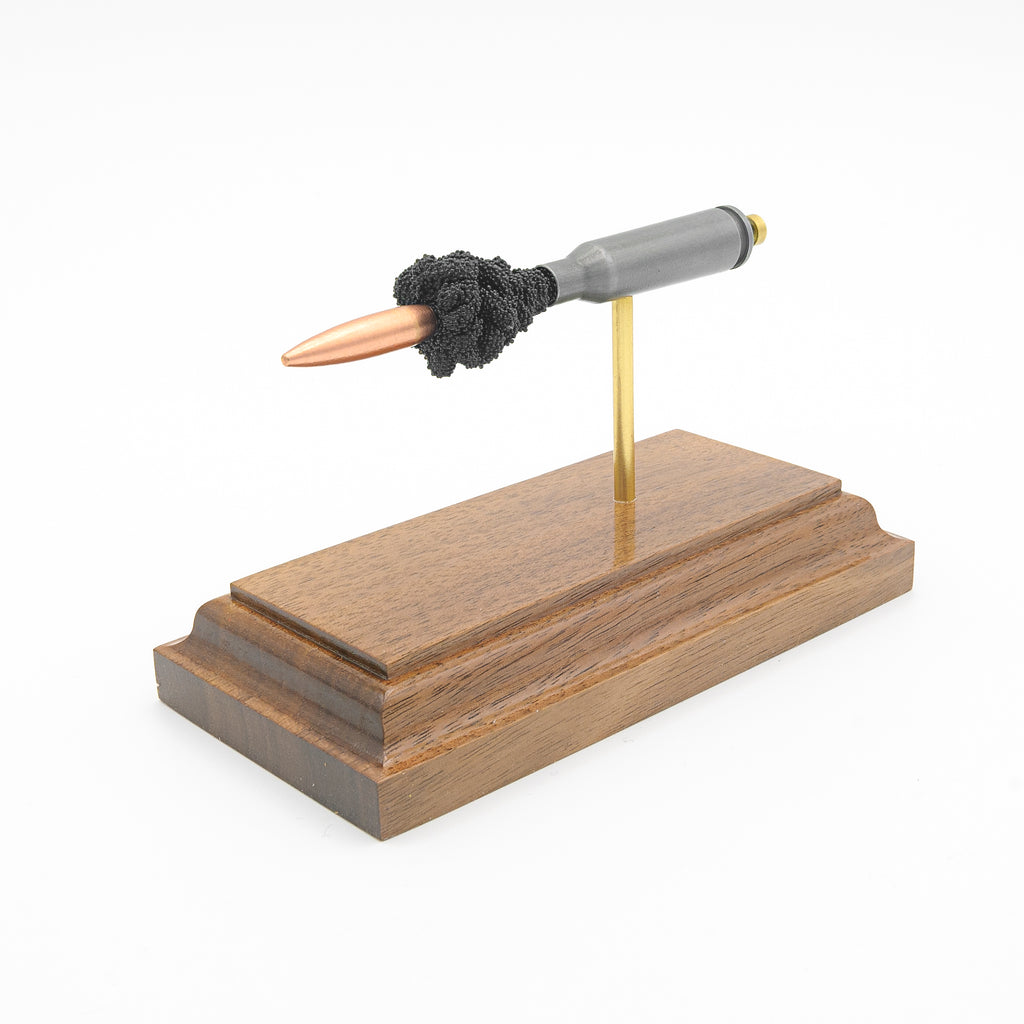5.45x39mm cutaway cartridge display mounted on solid hardwood base