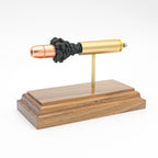 450 Bushmaster cutaway cartridge display mounted on solid hardwood base