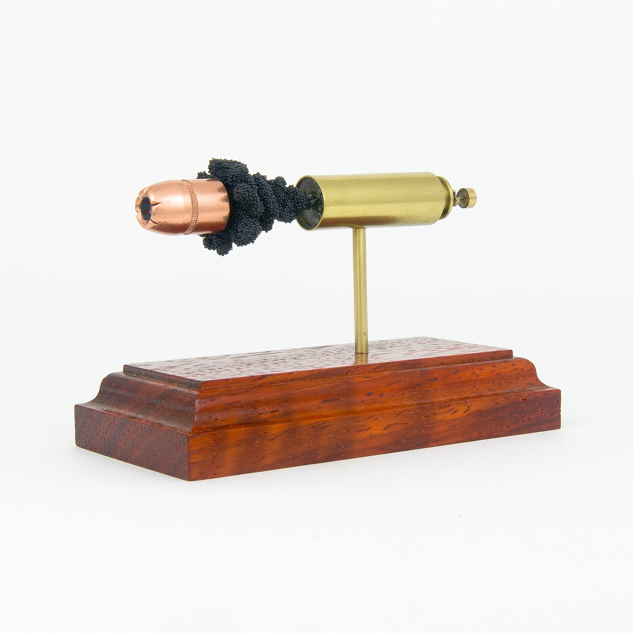 Sectioned 50 Beowulf cartridge showing primer case powder and 350gr XTP bullet aligned horizontally