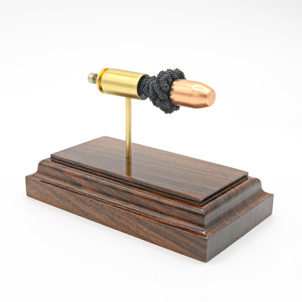 Expanded 40 S&W Winchester 180gr FMJ cartridge display on hardwood base