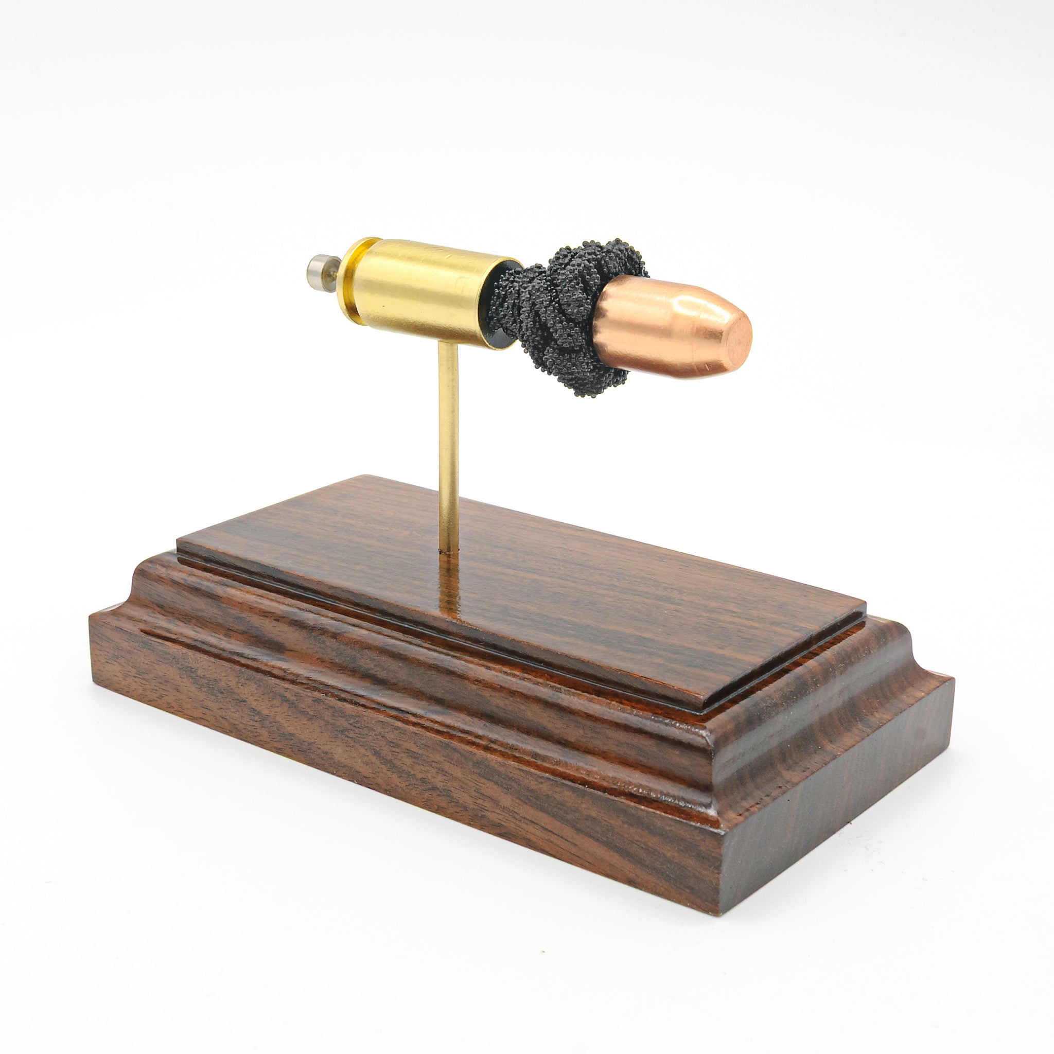 Expanded 40 S&W Winchester 180gr FMJ cartridge display on hardwood base